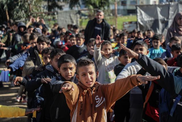 (260112) -- GAZA, Jan. 12, 2026 (Xinhua) -- Photo taken on Jan. 12, 2026 shows students in Al-Shamal Educational School, located just 100 meters from the "Yellow Line" in Jabalia Refugee Camp, northern Gaza Strip. (Photo by Rizek Abdeljawad/Xinhua)
