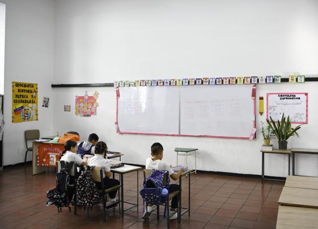 (260113) -- CARACAS, Jan. 13, 2026 (Xinhua) -- Students study in a classroom on the first day of the new semester in a public school in Caracas, Venezuela, Jan. 12, 2026. The second half of the 2025-2026 academic year for primary and secondary education began on Monday in Venezuela. (Xinhua/Ding Hongfa)