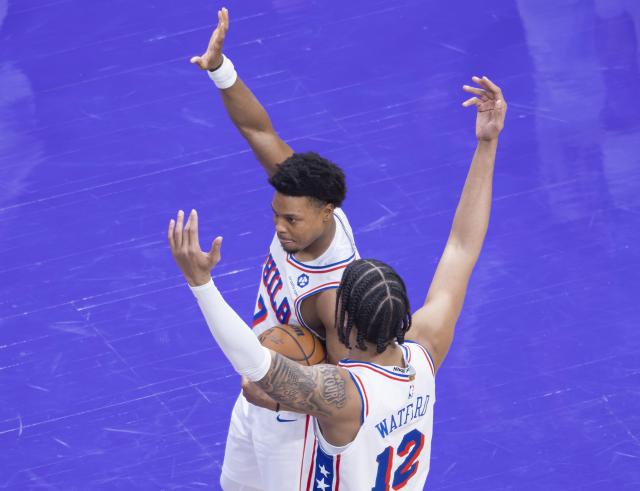 (260113) -- TORONTO, Jan. 13, 2026 (Xinhua) -- Kyle Lowry (back) of Philadelphia 76ers, a former Raptors player, waves to fans during the 2025-2026 NBA regular season game between Toronto Raptors and Philadelphia 76ers in Toronto, Canada, on Jan. 12, 2026. (Photo by Zou Zheng/Xinhua)