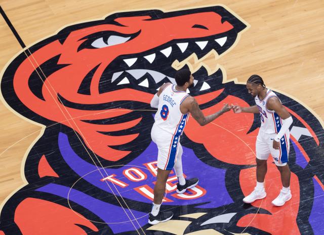 (260113) -- TORONTO, Jan. 13, 2026 (Xinhua) -- Paul George (L) and Tyrese Maxey of Philadelphia 76ers celebrate scoring during the 2025-2026 NBA regular season game between Toronto Raptors and Philadelphia 76ers in Toronto, Canada, on Jan. 12, 2026. (Photo by Zou Zheng/Xinhua)