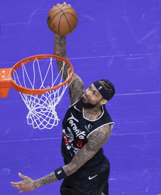 (260113) -- TORONTO, Jan. 13, 2026 (Xinhua) -- Brandon Ingram of Toronto Raptors dunks during the 2025-2026 NBA regular season game between Toronto Raptors and Philadelphia 76ers in Toronto, Canada, on Jan. 12, 2026. (Photo by Zou Zheng/Xinhua)
