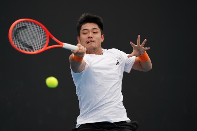 (260113) -- MELBOURNE, Jan. 13, 2026 (Xinhua) -- Wu Yibing of China hits a return during the men's singles qualifying 1st round match against Mitchell Krueger of the United States at Australian Open tennis tournament in Melbourne, Australia, Jan. 13, 2026. (Photo by Wang Shen/Xinhua)