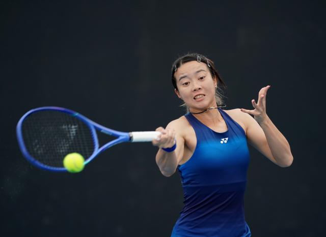 (260113) -- MELBOURNE, Jan. 13, 2026 (Xinhua) -- Ma Yexin of China hits a return during the women's singles qualifying 1st round match against Varvara Lepchenko of the United States at Australian Open tennis tournament in Melbourne, Australia, Jan. 13, 2026. (Photo by Wang Shen/Xinhua)