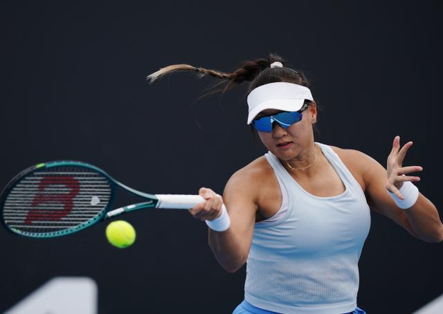 (260113) -- MELBOURNE, Jan. 13, 2026 (Xinhua) -- Guo Hanyu of China hits a return during the women's singles qualifying 1st round match against Dominika Salkova of the Czech Republic at Australian Open tennis tournament in Melbourne, Australia, Jan. 13, 2026. (Photo by Wang Shen/Xinhua)