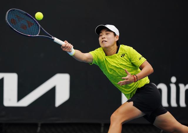 (260113) -- MELBOURNE, Jan. 13, 2026 (Xinhua) -- Bai Zhuoxuan of China hits a return during the women's singles qualifying 1st round match against Alina Korneeva of Russia at Australian Open tennis tournament in Melbourne, Australia, Jan. 13, 2026. (Photo by Wang Shen/Xinhua)