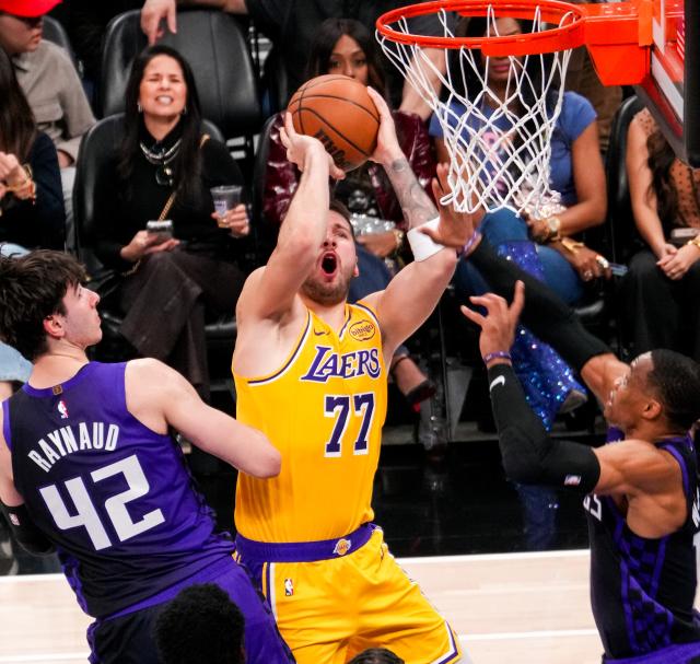 (260113) -- SACRAMENTO, Jan. 13, 2026 (Xinhua) -- Los Angeles Lakers' Luka Doncic (C) attempts a shot during the 2025-2026 NBA regular season game between Sacramento Kings and Los Angeles Lakers in Sacramento, the United States, on Jan. 12, 2026. (Photo by Sun Yuxuan/Xinhua)