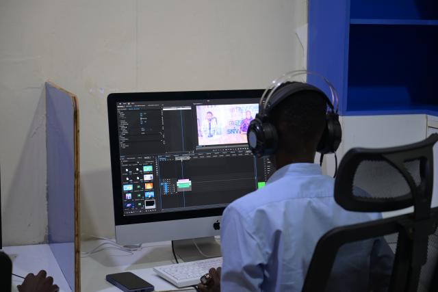 (260113) -- MOGADISHU, Jan. 13, 2026 (Xinhua) -- This photo taken on Jan. 12, 2026 shows an editorial staff member working at the Somali National Television in Mogadishu, Somalia. The Somali National Television resumed its broadcasting in 2011 after a two-decade break off due to the civil war. Nowadays, it is on air around the clock for audiences both at home and abroad. (Xinhua/Yang Guang)