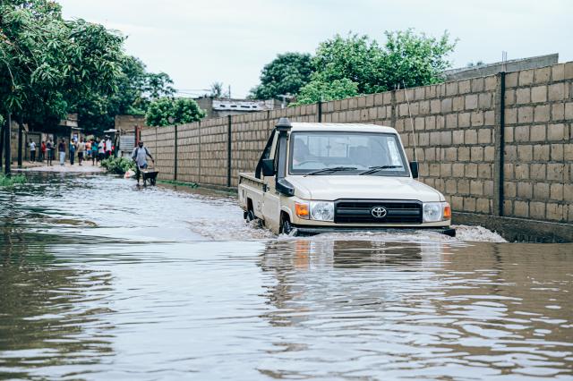 (260113) -- MATOLA, Jan. 13, 2026 (Xinhua) -- A car drives through floodwater caused by heavy rainfall in Matola City, Maputo Province, Mozambique, Jan. 12, 2026. Mozambique is currently in the peak of its rainy season, a period marked by frequent alerts for heavy rains and strong winds, particularly in the central and southern regions. (Photo by Mendes Mondlane/Xinhua)