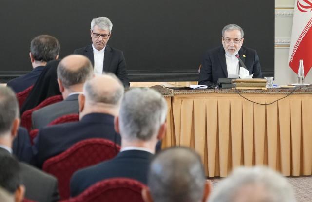 (260113) -- TEHRAN, Jan. 13, 2026 (Xinhua) -- Iranian Foreign Minister Abbas Araghchi (R, back) speaks during a meeting in Tehran, Iran, Jan. 12, 2026. Iranian Foreign Minister Abbas Araghchi said his country is ready for war but remains open to dialogue, after U.S. President Donald Trump said the U.S. military is considering "very strong options" regarding Iran amid recent unrest. (Photo by Javad/Xinhua)