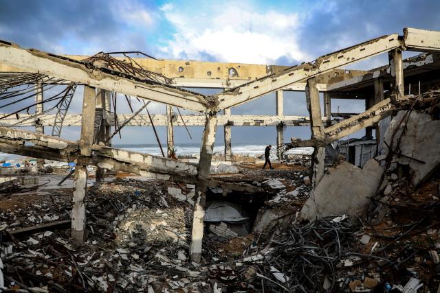(260113) -- GAZA, Jan. 13, 2026 (Xinhua) -- A Palestinian inspects a collapsed building due to the storm in Gaza City, Jan. 13, 2026. Four Palestinians were killed in Gaza City in two separate incidents, as heavy rain and strong winds swept the region on Tuesday. (Photo by Rizek Abdeljawad/Xinhua)
