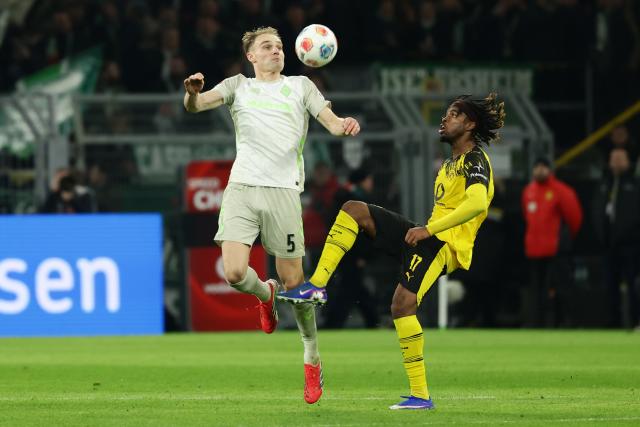 (260114) -- DORTMUND, Jan. 14, 2026 (Xinhua) -- Carney Chukwuemeka (R) of Borussia Dortmund vies with Amos Pieper of SV Werder Bremen during the German first division Bundesliga football match between Borussia Dortmund and SV Werder Bremen in Dortmund, Germany, Jan. 13, 2026. (Photo by Joachim Bywaletz/Xinhua)