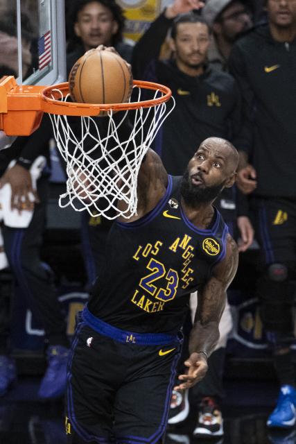 (260114) -- LOS ANGELES, Jan. 14, 2026 (Xinhua) -- Los Angeles Lakers' LeBron James dunks during the 2025-2026 NBA regular season game between Los Angeles Lakers and Atlanta Hawks in, Los Angeles, the United States, on Jan. 13, 2026. (Photo by Ringo Chiu/Xinhua)