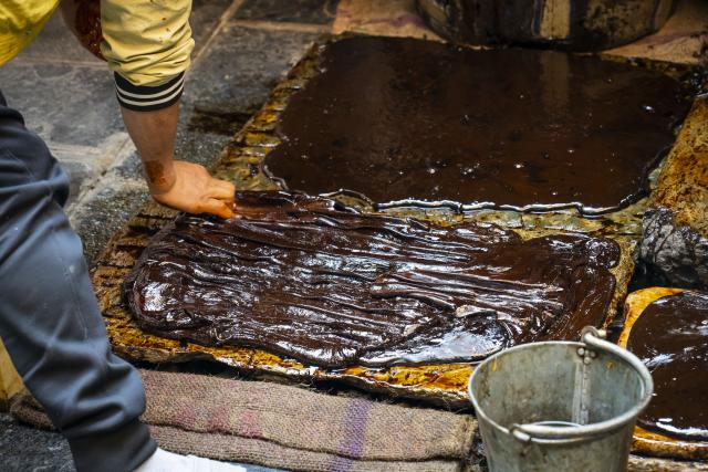 (260114) -- LALITPUR, Jan. 14, 2026 (Xinhua) -- A worker prepares molasses for the upcoming Maghe Sankranti Festival at a confectionery factory in Lalitpur, Nepal, Jan. 13, 2026. Nepalese prepare molasses ("Chaku" in local language) for the festival and the winter season. (Photo by Hari Maharjan/Xinhua)