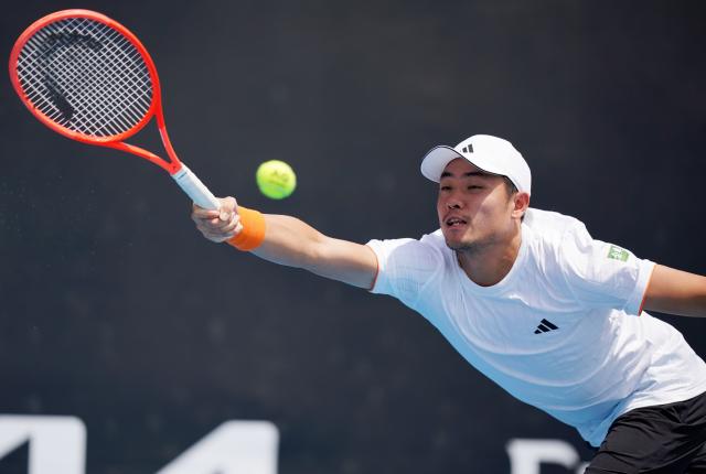 (260114) -- MELBOURNE, Jan. 14, 2026 (Xinhua) -- Wu Yibing of China competes during the men's singles qualifying 2nd round match against Nicolas Mejia of Columbia at Australian Open tennis tournament in Melbourne, Australia, Jan. 14, 2026. (Photo by Wang Shen/Xinhua)