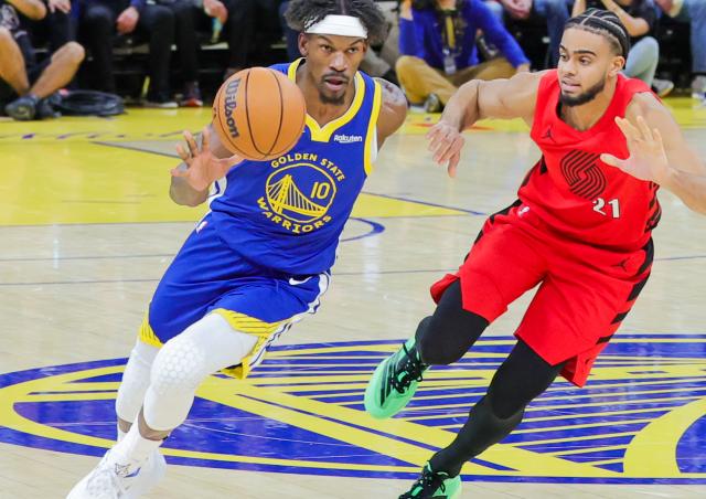 (260114) -- SAN FRANCISCO, Jan. 14, 2026 (Xinhua) -- Golden State Warriors' Jimmy Butler (L) competes during the 2025-2026 NBA regular season basketball game between Golden State Warriors and Portland Trail Blazers in San Francisco, the United States, Jan. 13, 2026. (Photo by Dong Xudong/Xinhua)