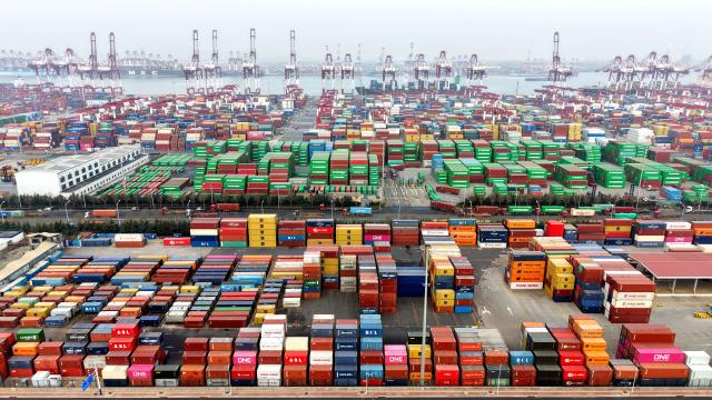 (260114) -- BEIJING, Jan. 14, 2026 (Xinhua) -- An aerial drone photo taken on Jan. 14, 2026 shows a scene at a container terminal for foreign trade at Qingdao Port in east China's Shandong Province. Last year, China's foreign trade value hit 45.47 trillion yuan (about 6.48 trillion U.S. dollars), up 3.8 percent year on year, according to data released by the General Administration of Customs on Wednesday. This marks the ninth consecutive year of growth for China's foreign trade since 2017. (Photo by Yu Fangping/Xinhua)