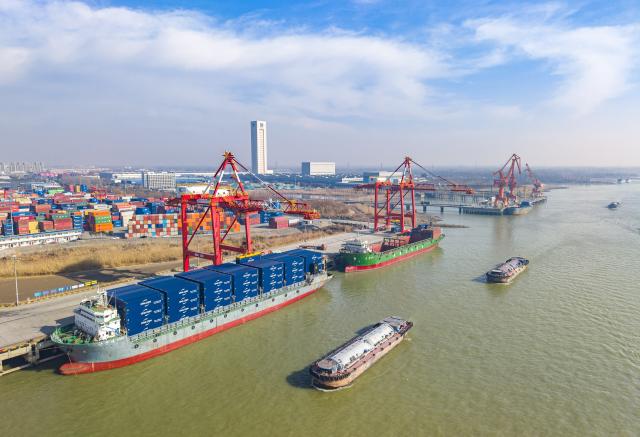 (260114) -- BEIJING, Jan. 14, 2026 (Xinhua) -- An aerial drone photo taken on Jan. 14, 2026 shows a view of Yangzhou Port in Yangzhou, east China's Jiangsu Province. Last year, China's foreign trade value hit 45.47 trillion yuan (about 6.48 trillion U.S. dollars), up 3.8 percent year on year, according to data released by the General Administration of Customs on Wednesday. This marks the ninth consecutive year of growth for China's foreign trade since 2017. (Photo by Ren Fei/Xinhua)