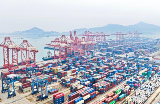 (260114) -- BEIJING, Jan. 14, 2026 (Xinhua) -- An aerial drone photo taken on Jan. 14, 2026 shows a scene at a container terminal of Lianyungang Port in Lianyungang, east China's Jiangsu Province. Last year, China's foreign trade value hit 45.47 trillion yuan (about 6.48 trillion U.S. dollars), up 3.8 percent year on year, according to data released by the General Administration of Customs on Wednesday. This marks the ninth consecutive year of growth for China's foreign trade since 2017. (Photo by Wang Jianmin/Xinhua)