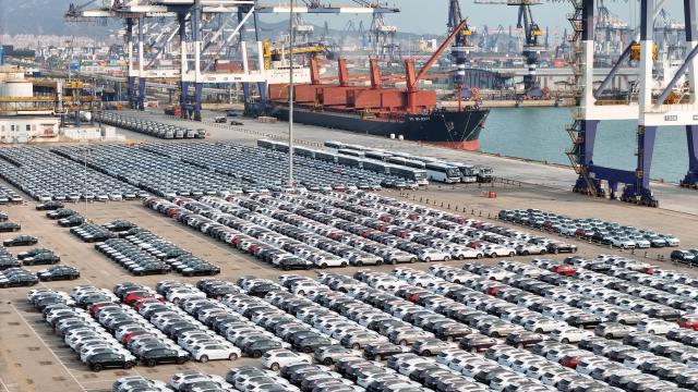 (260114) -- BEIJING, Jan. 14, 2026 (Xinhua) -- An aerial drone photo taken on Jan. 14, 2026 shows domestic vehicles to be loaded for export at Yantai Port in east China's Shandong Province. Last year, China's foreign trade value hit 45.47 trillion yuan (about 6.48 trillion U.S. dollars), up 3.8 percent year on year, according to data released by the General Administration of Customs on Wednesday. This marks the ninth consecutive year of growth for China's foreign trade since 2017. (Photo by Tang Ke/Xinhua)