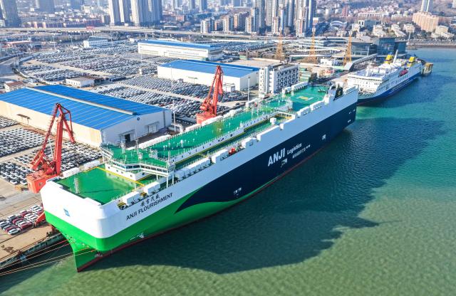 (260114) -- BEIJING, Jan. 14, 2026 (Xinhua) -- An aerial drone photo taken on Dec. 17, 2025 shows a cargo ship loading vehicles for export at Lianyungang port in Lianyungang, east China's Jiangsu Province. China's automobile production and sales both exceeded 34 million units last year, setting a new record high, industry data showed on Wednesday.
   New energy vehicles (NEVs) accelerated their growth momentum, with production and sales totaling 16.626 million and 16.49 million units, respectively, marking respective year-on-year increases of 29 percent and 28.2 percent, and maintaining the top position in the world for 11 straight years, the China Association of Automobile Manufacturers confirmed. (Photo by Wang Jianmin/Xinhua)