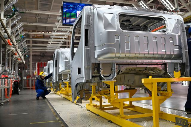 (260114) -- BEIJING, Jan. 14, 2026 (Xinhua) -- A worker operates at the assembly workshop of a new energy vehicle company in Shangqiu, central China's Henan Province, Dec. 30, 2025. China's automobile production and sales both exceeded 34 million units last year, setting a new record high, industry data showed on Wednesday.
   New energy vehicles (NEVs) accelerated their growth momentum, with production and sales totaling 16.626 million and 16.49 million units, respectively, marking respective year-on-year increases of 29 percent and 28.2 percent, and maintaining the top position in the world for 11 straight years, the China Association of Automobile Manufacturers confirmed. (Photo by Li Heng/Xinhua)