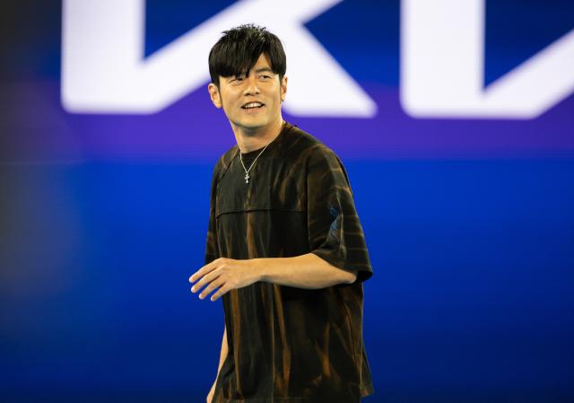 (260114) -- MELBOURNE, Jan. 14, 2026 (Xinhua) -- Chinese pop singer Jay Chou reacts during the 1 point slam event against Petar Jovic of Australia at Australian Open tennis tournament in Melbourne, Australia, Jan. 14, 2026. (Photo by Hu Jingchen/Xinhua)