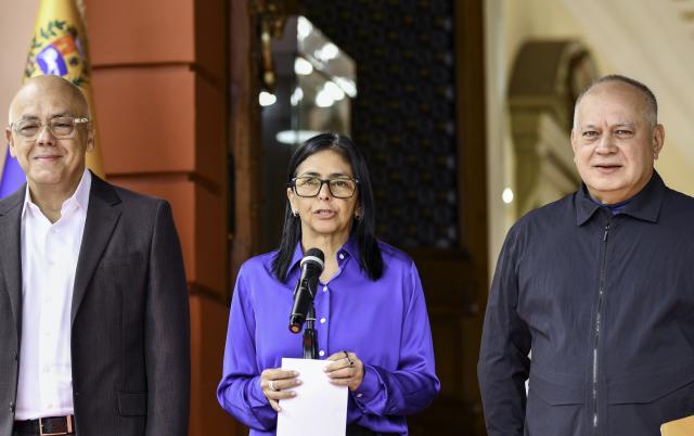 (260114) -- CARACAS, Jan. 14, 2026 (Xinhua) -- Venezuela's acting president Delcy Rodriguez (C), National Assembly President Jorge Rodriguez (1st L) and Interior Minister Diosdado Cabello attend a press conference in Caracas, Venezuela, Jan. 14, 2026. (Xinhua/Ding Hongfa)