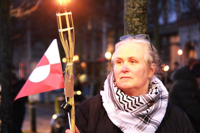 (260114) -- COPENHAGEN, Jan. 14, 2026 (Xinhua) -- A woman participate in a protest against U.S. plans on Greenland in Copenhagen, Denmark, Jan. 14, 2026. About 200 protesters rallied outside the U.S. Embassy in Denmark Wednesday, expressing opposition to Washington's plans on Greenland as Danish and Greenlandic officials met with U.S. Vice President JD Vance and Secretary of State Marco Rubio in Washington. (Photo by Liu Zhichao/Xinhua)