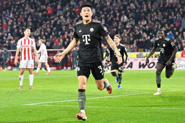 (260115) -- COLOGNE, Jan. 15, 2026 (Xinhua) -- Kim Min-jae (front) of FC Bayern Munich celebrates scoring during the German first division Bundesliga football match between FC Cologne and FC Bayern Munich in Cologne, Germany, Jan. 14, 2026. (Photo by Ulrich Hufnagel/Xinhua)