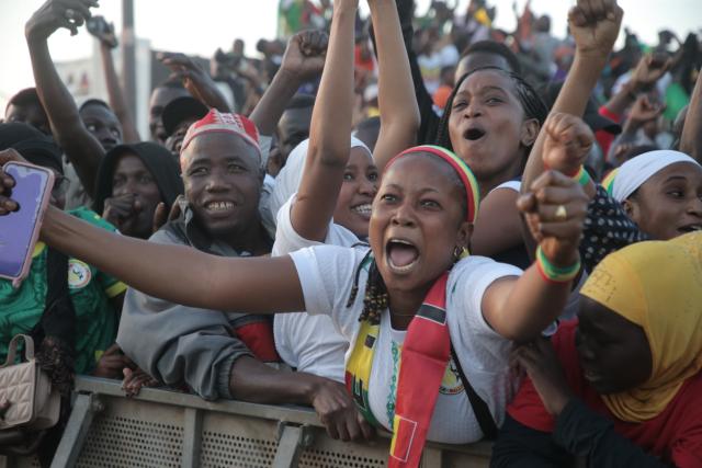 (260115) -- DAKAR, Jan. 15, 2026 (Xinhua) -- Fans celebrate as Senegal defeats Egypt in the 2025 Africa Cup of Nations semifinal football match on a giant screen at the Place de la Nation in Dakar, Senegal, Jan. 14, 2026. (Photo by Aliou Mbaye/Xinhua)