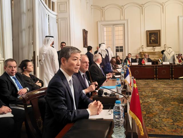 (260115) -- CAIRO, Jan. 15, 2026 (Xinhua) -- This photo taken with a mobile phone shows Chinese Ambassador to Egypt Liao Liqiang attending the fifth consultative meeting on enhancing coordination of peace efforts in Sudan held in Cairo, Egypt, Jan. 14, 2026. Egypt will not accept, under any circumstances, the collapse of Sudan, its national institutions, or the fragmentation of its territory, Egyptian Foreign Minister Badr Abdelatty said on Wednesday.
   TO GO WITH "Egypt will not accept Sudan's collapse, territorial fragmentation: FM" (Xinhua/Yao Bing)