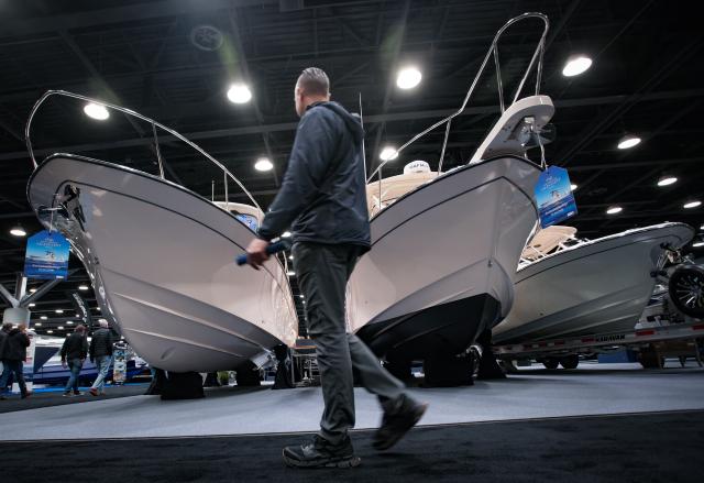 (260115) -- VANCOUVER, Jan. 15, 2026 (Xinhua) -- A man walks past yachts on display during the Vancouver International Boat Show 2026 at the Vancouver Convention Centre in Vancouver, British Columbia, Canada, Jan. 14, 2026. The five-day show kicked off here on Wednesday, with hundreds of exhibitors from around the world showcasing the latest vessels, marine gears and marine technology. (Photo by Liang Sen/Xinhua)
