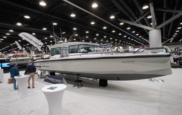 (260115) -- VANCOUVER, Jan. 15, 2026 (Xinhua) -- People view a luxury yacht during the Vancouver International Boat Show 2026 at the Vancouver Convention Centre in Vancouver, British Columbia, Canada, Jan. 14, 2026. The five-day show kicked off here on Wednesday, with hundreds of exhibitors from around the world showcasing the latest vessels, marine gears and marine technology. (Photo by Liang Sen/Xinhua)