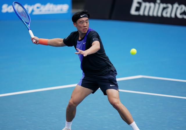 (260115) -- MELBOURNE, Jan. 15, 2026 (Xinhua) -- Coleman Wong of China's Hong Kong hits a return during the men's singles qualifying final round match against Elias Ymer of Sweden at Australian Open tennis tournament in Melbourne, Australia, Jan. 15, 2026. (Photo by Wang Shen/Xinhua)