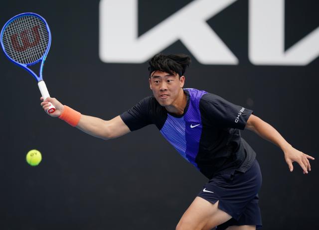 (260115) -- MELBOURNE, Jan. 15, 2026 (Xinhua) -- Coleman Wong of China's Hong Kong hits a return during the men's singles qualifying final round match against Elias Ymer of Sweden at Australian Open tennis tournament in Melbourne, Australia, Jan. 15, 2026. (Photo by Wang Shen/Xinhua)