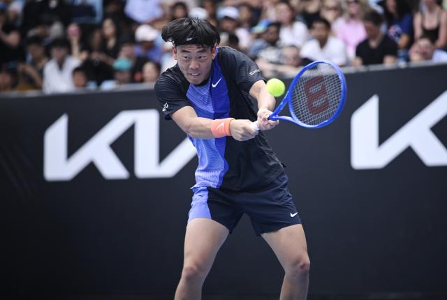 (260115) -- MELBOURNE, Jan. 15, 2026 (Xinhua) -- Coleman Wong of China's Hong Kong hits a return during the men's singles qualifying final round match against Elias Ymer of Sweden at Australian Open tennis tournament in Melbourne, Australia, Jan. 15, 2026. (Photo by Wang Shen/Xinhua)