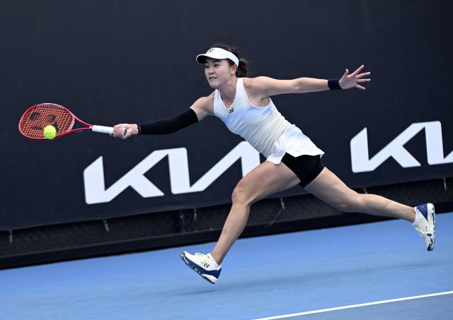 (260115) -- MELBOURNE, Jan. 15, 2026 (Xinhua) -- Zhu Lin of China hits a return during the women's singles qualifying final round match against Marina Stakusic of Canada at Australian Open tennis tournament in Melbourne, Australia, Jan. 15, 2026. (Photo by Wang Shen/Xinhua)