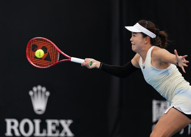 (260115) -- MELBOURNE, Jan. 15, 2026 (Xinhua) -- Zhu Lin of China hits a return during the women's singles qualifying final round match against Marina Stakusic of Canada at Australian Open tennis tournament in Melbourne, Australia, Jan. 15, 2026. (Photo by Wang Shen/Xinhua)