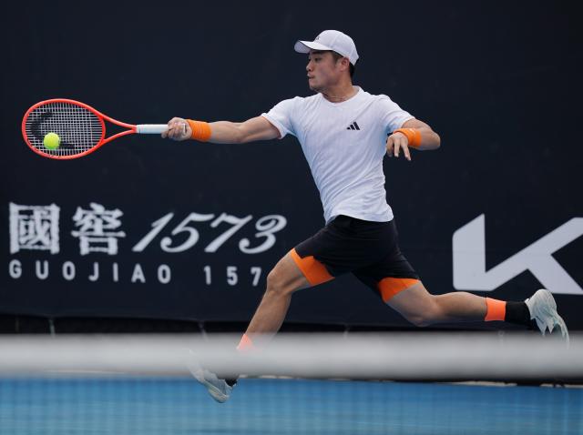 (260115) -- MELBOURNE, Jan. 15, 2026 (Xinhua) -- Wu Yibing of China hits a return during the men's singles qualifying final round match against Tristan Boyer of the United States at Australian Open tennis tournament in Melbourne, Australia, Jan. 15, 2026. (Photo by Wang Shen/Xinhua)