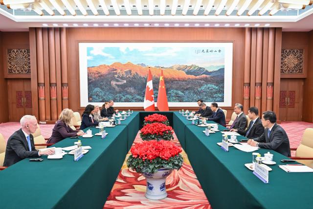 (260115) -- BEIJING, Jan. 15, 2026 (Xinhua) -- Chinese Foreign Minister Wang Yi, also a member of the Political Bureau of the Communist Party of China Central Committee, meets with Canadian Foreign Minister Anita Anand in Beijing, capital of China, Jan. 15, 2026. (Xinhua/Li Xin)