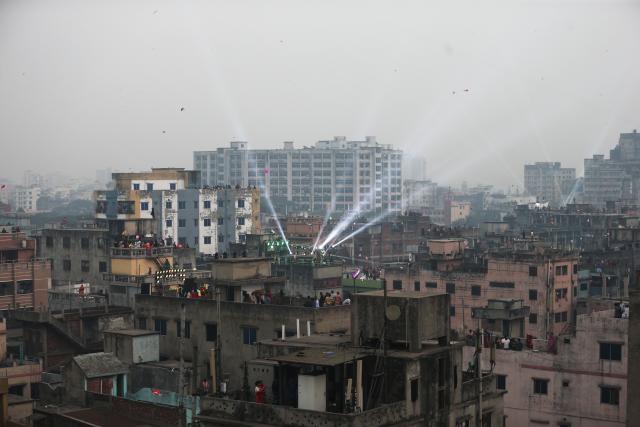 (260115) -- DHAKA, Jan. 15, 2026 (Xinhua) -- People fly kites during the Sakrain festival in Dhaka, Bangladesh, Jan. 14, 2026. People in Dhaka celebrated Sakrain festival, also known as Ghuri Utsob or Kite festival, at the end of Poush, the ninth month of the Bengali calendar. (Photo by Habibur Rahman/Xinhua)