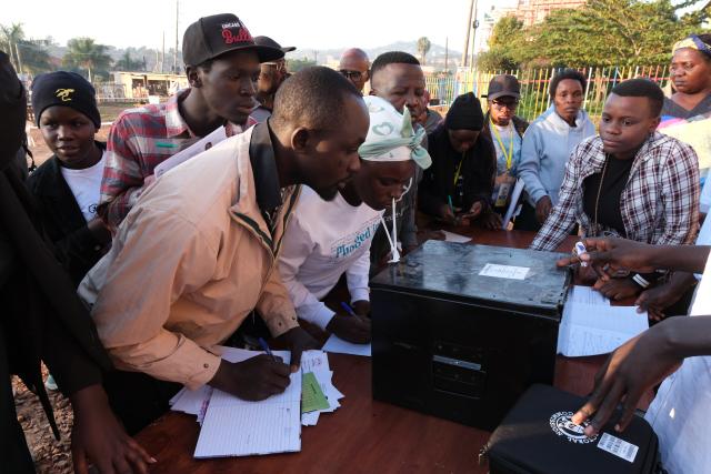 (260115) -- KAMPALA, Jan. 15, 2026 (Xinhua) -- Polling agents witness the unsealing of a ballot box at a polling station in Kampala, Uganda, on Jan. 15, 2026. Presidential and parliamentary elections kicked off in Uganda as people queued to cast ballots on Thursday.
   More than 21 million Ugandans are expected to vote to elect the president, 353 directly elected members of parliament and 146 district women representatives on the day.
   Eight candidates are vying for the presidency, including incumbent President Yoweri Museveni, who is seeking a seventh five-year term in office. His main rival is Robert Kyagulanyi, also known as Bobi Wine, a pop-star-turned politician. (Photo by Hajarah Nalwadda/Xinhua)