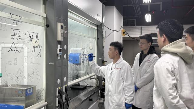 (260115) -- HEFEI, Jan. 15, 2026 (Xinhua) -- Zhang Shuchen (1st L), a member of an international research team, is pictured at a lab at the University of Science and Technology of China in Hefei, east China's Anhui Province, Jan. 14, 2026.
  An international research team has developed a "self-etching" technique to process soft and unstable ionic crystal lattice semiconductors, specifically 2D perovskite thin-layer single crystals, without damaging their structure, thereby overcoming a key challenge in the field of optoelectronic materials.
  The study, led by researchers from the University of Science and Technology of China, Purdue University and ShanghaiTech University, was published on Thursday in the journal Nature.
  TO GO WITH "Int'l research team develops damage-free etching technique for optoelectronic semiconductors" (University of Science and Technology of China/Handout via Xinhua)