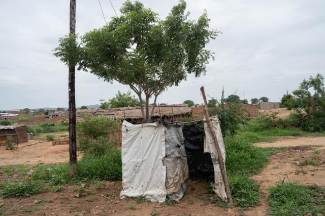 (260115) -- TETE, Jan. 15, 2026 (Xinhua) -- This photo taken on Dec. 24, 2025 shows the makeshift area previously used by residents for defecation before the construction of sanitation facilities in Tete City, Mozambique. TO GO WITH "Chinese-built sanitation project improves lives in Mozambique's Tete City" (Xinhua/Liu Jie)