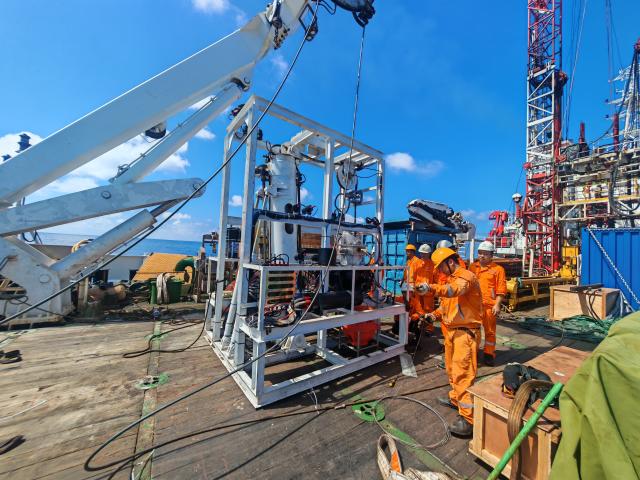(260115) -- SOUTH CHINA SEA, Jan. 15, 2026 (Xinhua) -- Staff members prepare the trial operation of China's first domestically developed undersea robot capable of three-dimensional drilling and in-situ monitoring within seabed strata in the South China Sea, Oct. 14, 2025. TO GO WITH "China Focus: China unveils undersea drilling robot to boost deep-sea exploration" (Guangzhou Marine Geological Survey/Handout via Xinhua)