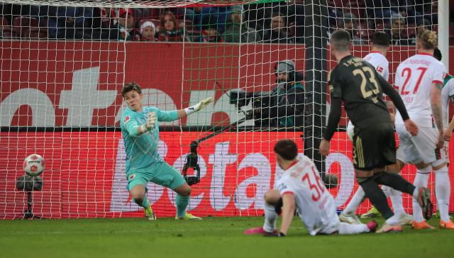 (251216) -- AUGSBURG, Dec. 16, 2025 (Xinhua) -- Finn Dahmen (1st L), goalkeeper of FC Augsburg fails to save the goal of Marin Ljubicic (not in the picture) of 1. FC Union Berlin during the German first division Bundesliga football match between FC Augsburg and 1. FC Union Berlin in Augsburg, Germany, Jan. 15, 2026. (Photo by Philippe Ruiz/Xinhua)