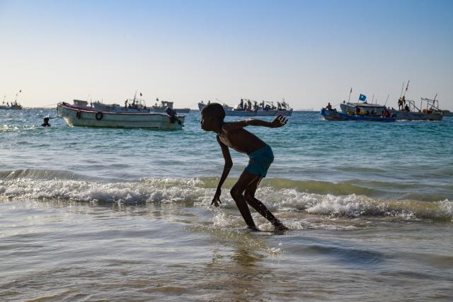 (260116) -- BEIJING, Jan. 16, 2026 (Xinhua) -- This photo taken on Jan. 11, 2026 shows a boy having fun at seaside in Mogadishu, Somalia. (Xinhua/Yang Guang)