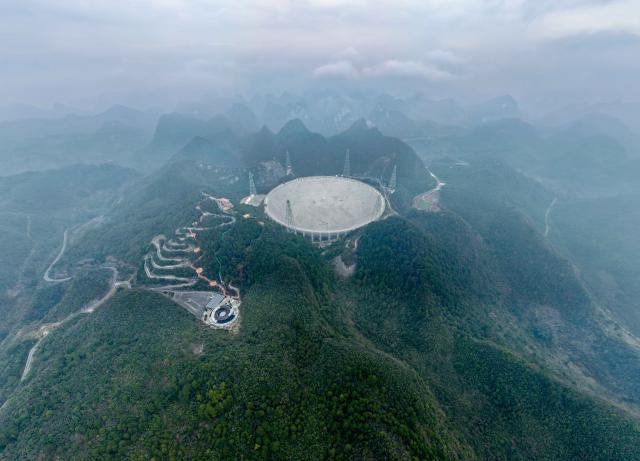 (260116) -- GUIYANG, Jan. 16, 2026 (Xinhua) -- An aerial drone photo taken on Jan. 16, 2026 shows China's Five-hundred-meter Aperture Spherical Radio Telescope (FAST) under maintenance in southwest China's Guizhou Province. Through studying the observation data of China's gigantic radio telescope located in the country's southwestern Guizhou Province, an international research team has uncovered compelling new evidence supporting a binary-system origin for at least some fast radio bursts, one of the most enigmatic phenomena in modern astrophysics.
   These findings made by the research team, led by astronomers from the Purple Mountain Observatory of the Chinese Academy of Sciences, are based on observations using FAST, and have been published online in the journal Science. (Xinhua/Ou Dongqu)