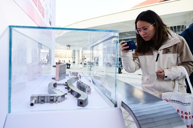 (260116) -- HEFEI, Jan. 16, 2026 (Xinhua) -- A delegate visits the Fusion Energy Technology and Industry Conference 2026 in Hefei, east China's Anhui Province, Jan. 16, 2026. The conference is held here from Jan. 16 to Jan. 17, which aims to build a collaborative and progressive innovation and industrial ecosystem for nuclear fusion energy. (Xinhua/Zhou Mu)