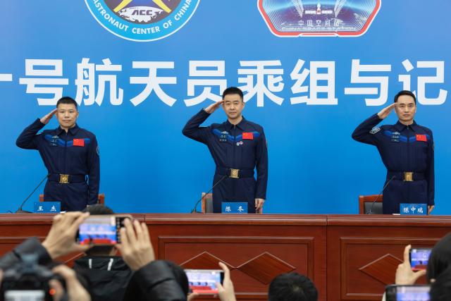 (260116) -- BEIJING, Jan. 16, 2026 (Xinhua) -- The three astronauts Chen Dong (C), Chen Zhongrui (R) and Wang Jie from China's Shenzhou-20 crewed mission salute during a press conference in Beijing, capital of China, Jan. 16, 2026. The three astronauts from China's Shenzhou-20 crewed mission met the press in Beijing on Friday, their first public appearance after returning to Earth in November last year. (Xinhua/Li Minggang)